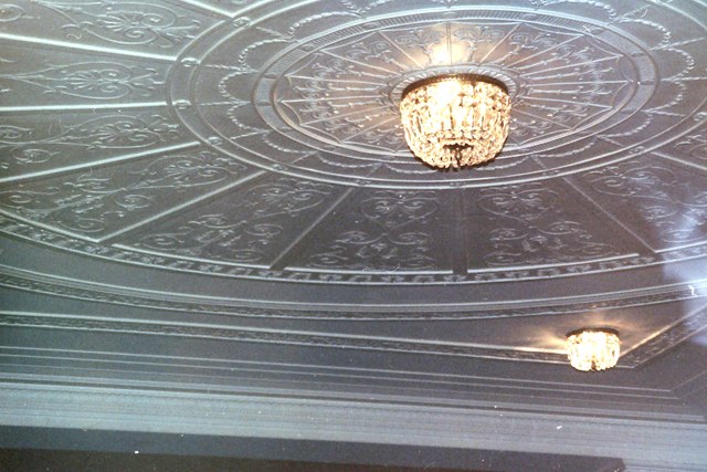 The ceiling with chandeliers.